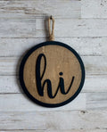 "Hi" Round Wood Wall Hanger – Raised Letters with Jute Rope